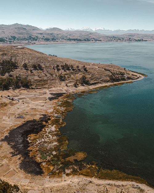 Titicaca, a sacred lake between mountains, home to floating islands and ancient culture.
